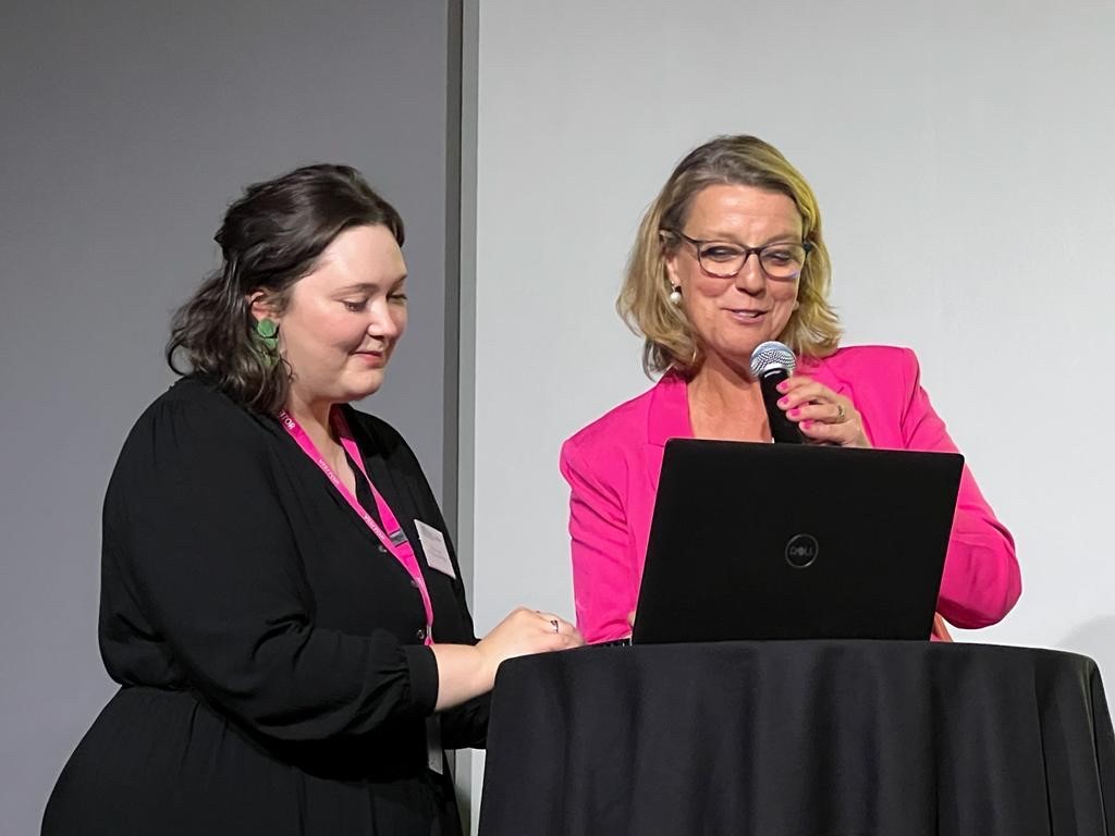 Eugenie and Julia looking at laptop